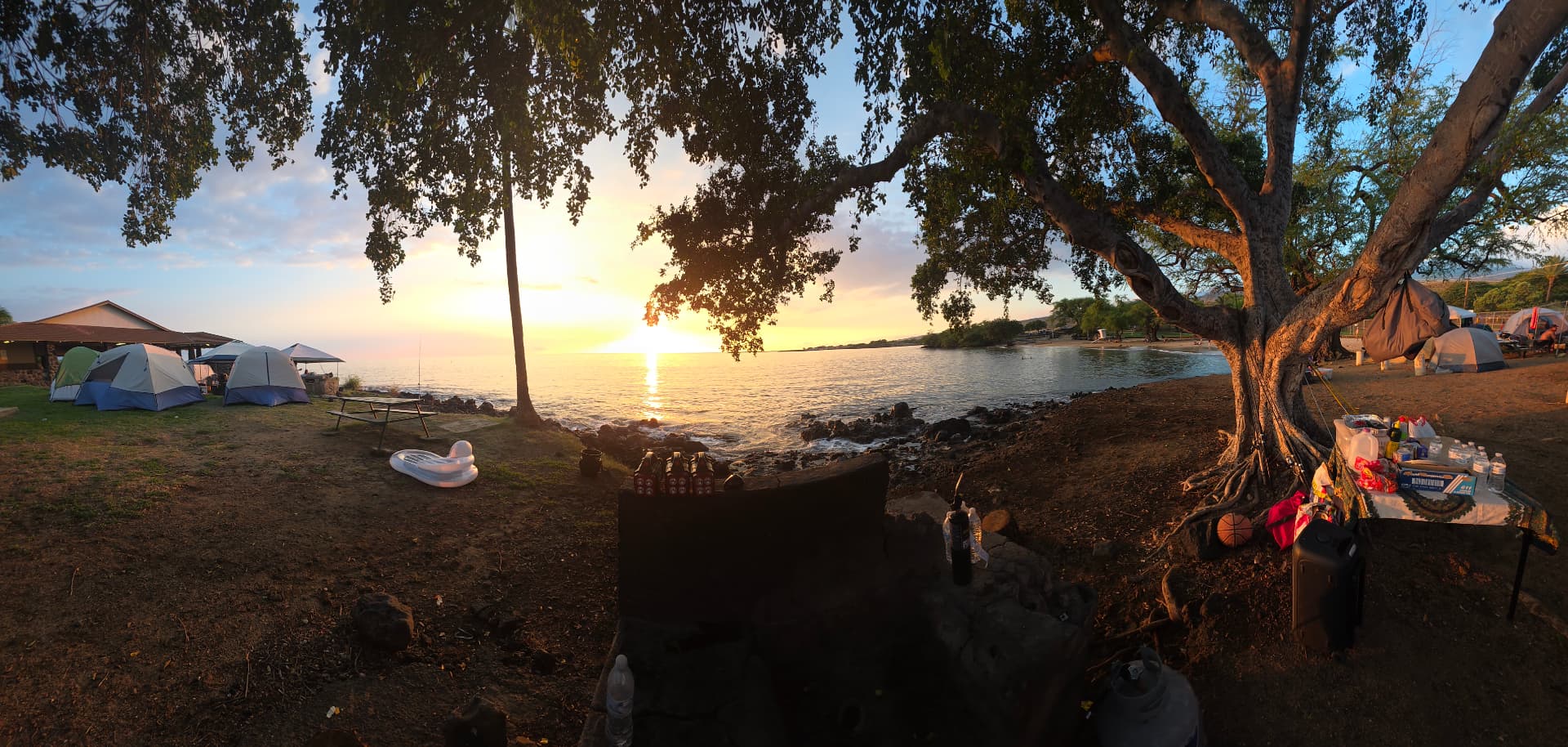 Sunset over the ocean at the Hawaiʻi Island beach park camp site