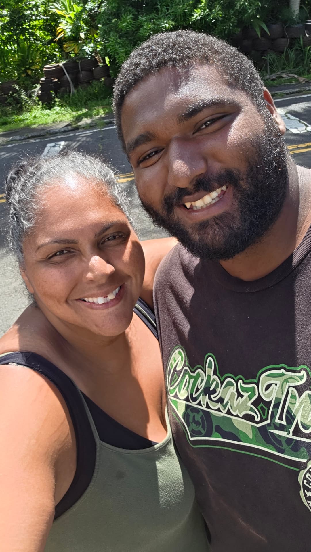 COTA Foundation founder Shaunna Cota with a young man she mentors on a Hilo street